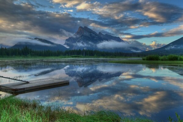 Reflection of rocks in a lake in the mountains