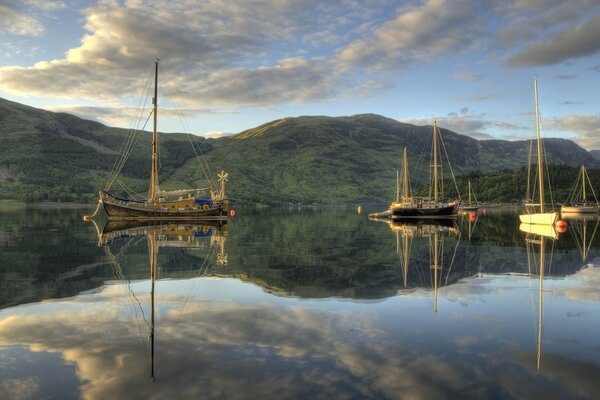 A beautiful lake against the background of mountains in which everything is reflected as in a mirror