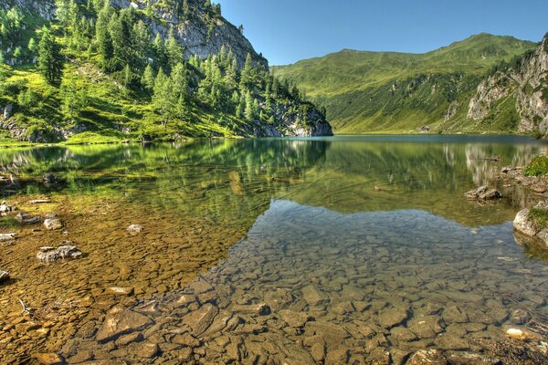 In Austria, the clear waters of lakes in the mountains