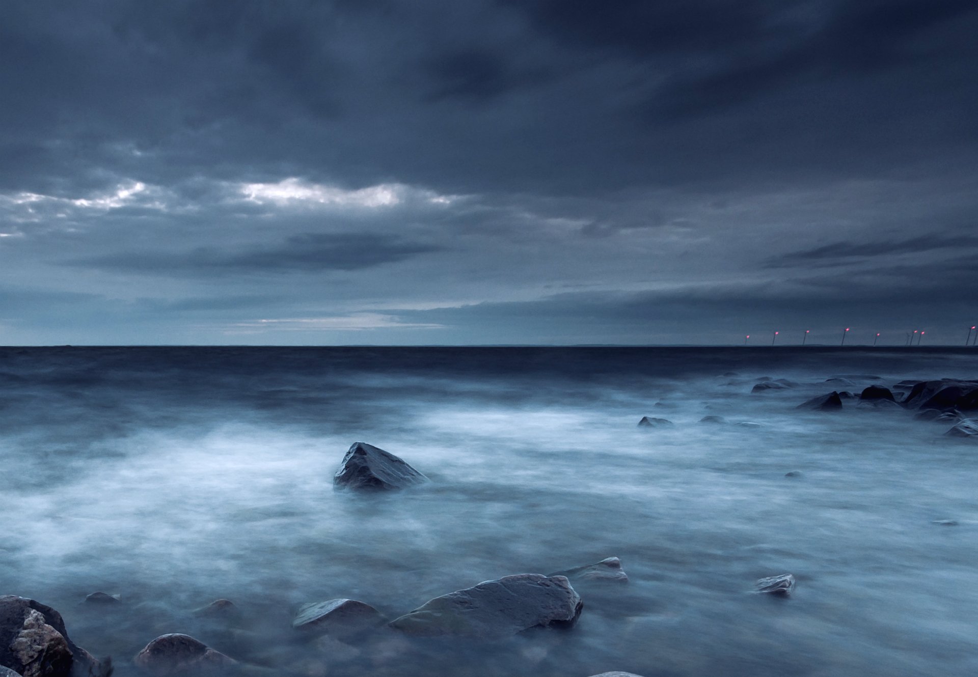 weden sea coast stones evening sky clouds beach night