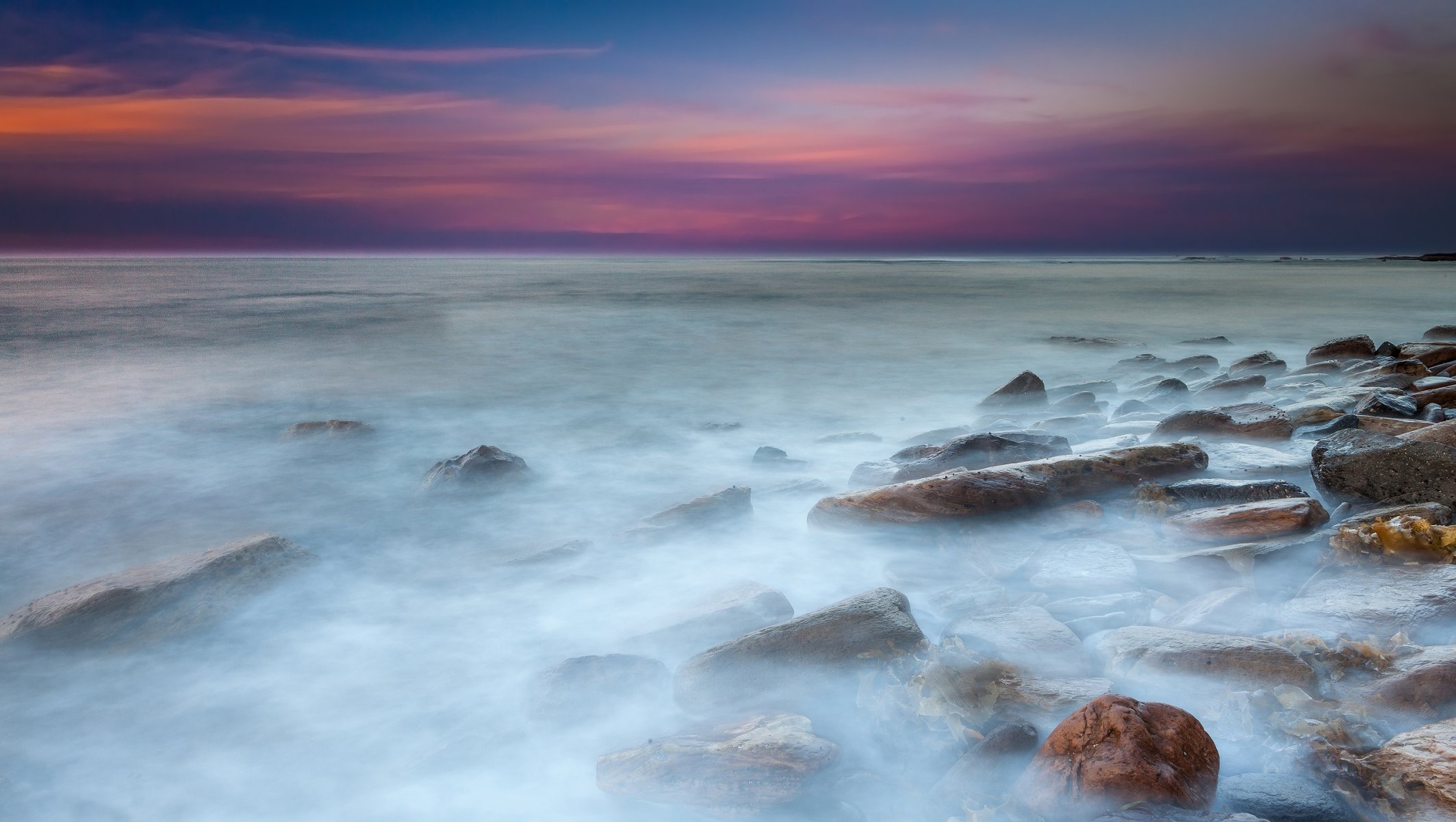 puesta de sol mar piedras agua exposición