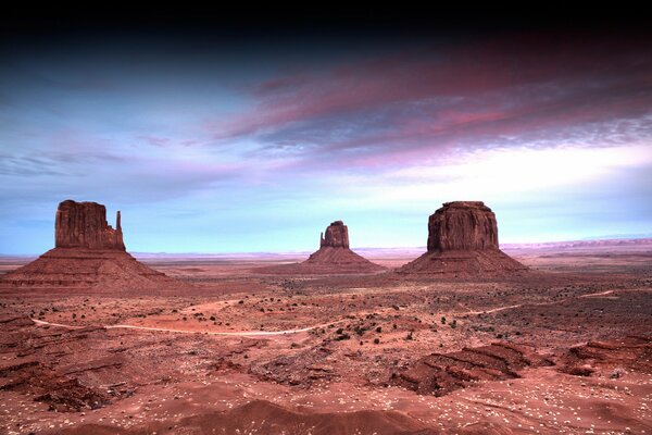 Desert landscape by night sky gradient