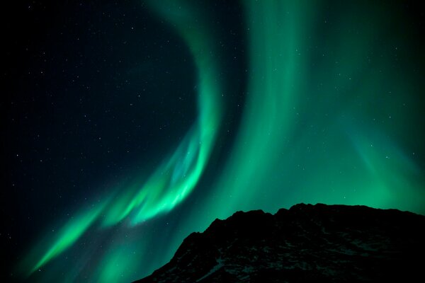 Beautiful northern lights over the mountain
