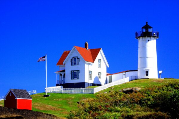 America house on the field near the lighthouse