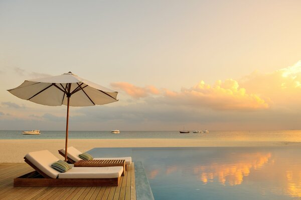 Beautiful sunset by the ocean in the Maldives