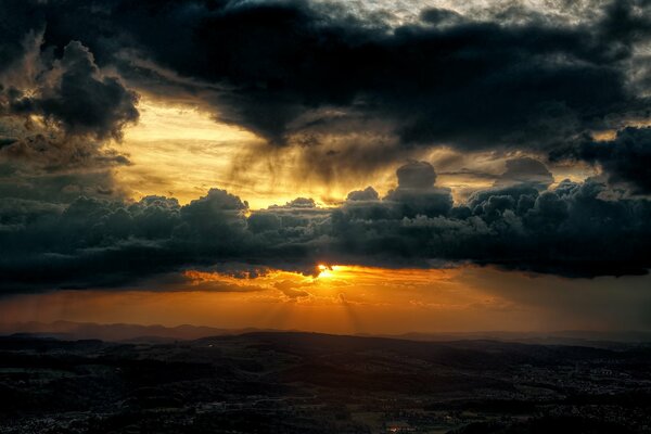 The sun disappeared behind clouds in the valley