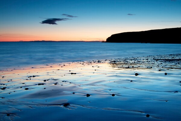 Evening sky and the ebb of the sea