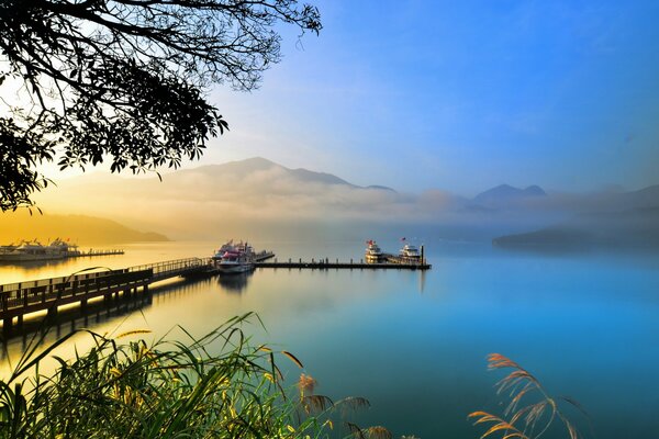 Boat pier on the lake in the mountains