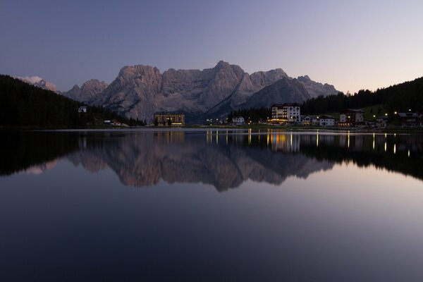 High mountains with houses and a lake