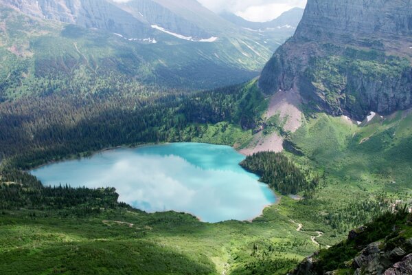 Azure lake at the foot of the mountain