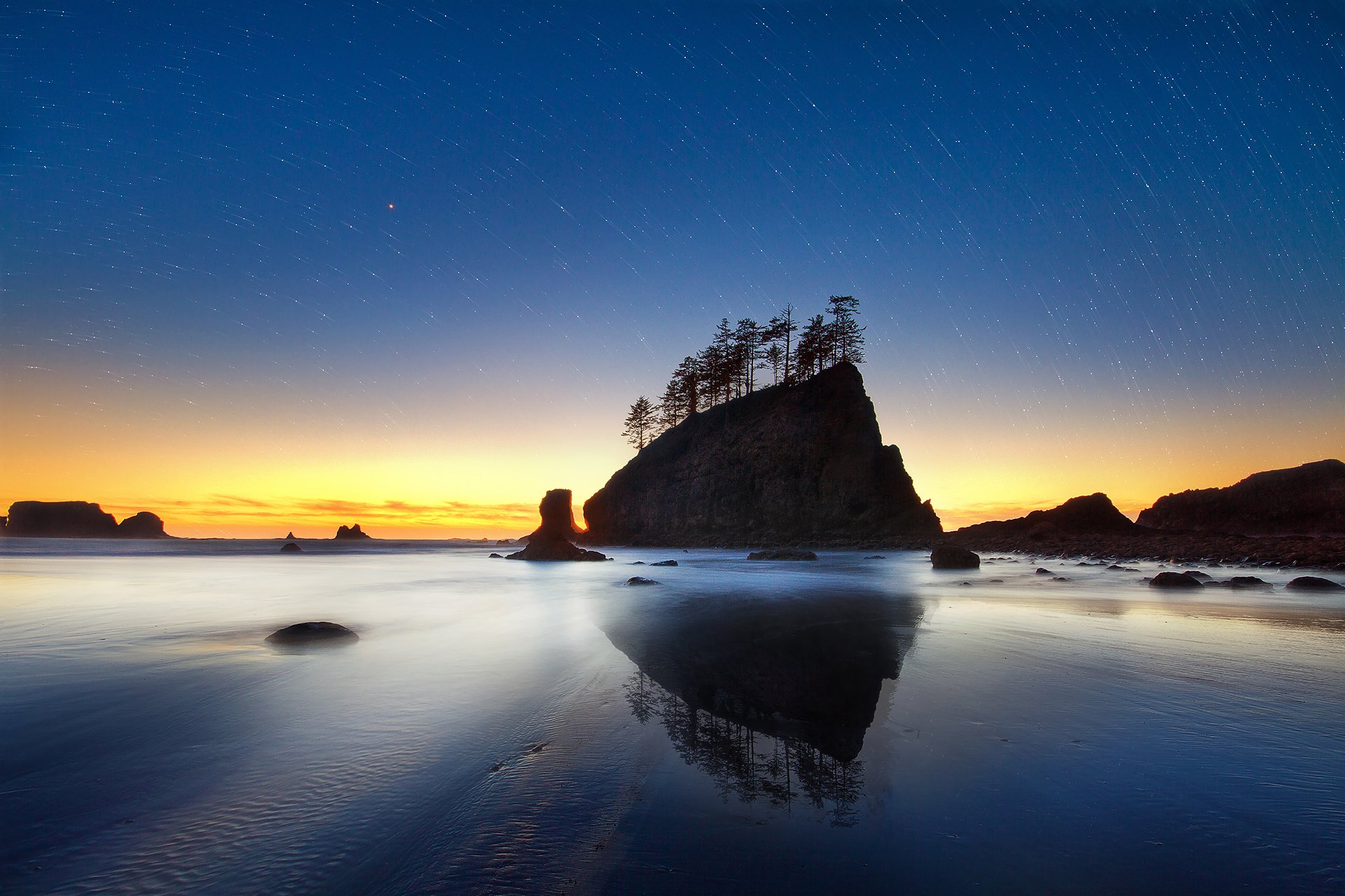 ea ocean shore beach sand water sunset rock rocks trees night evening sky stars cycle