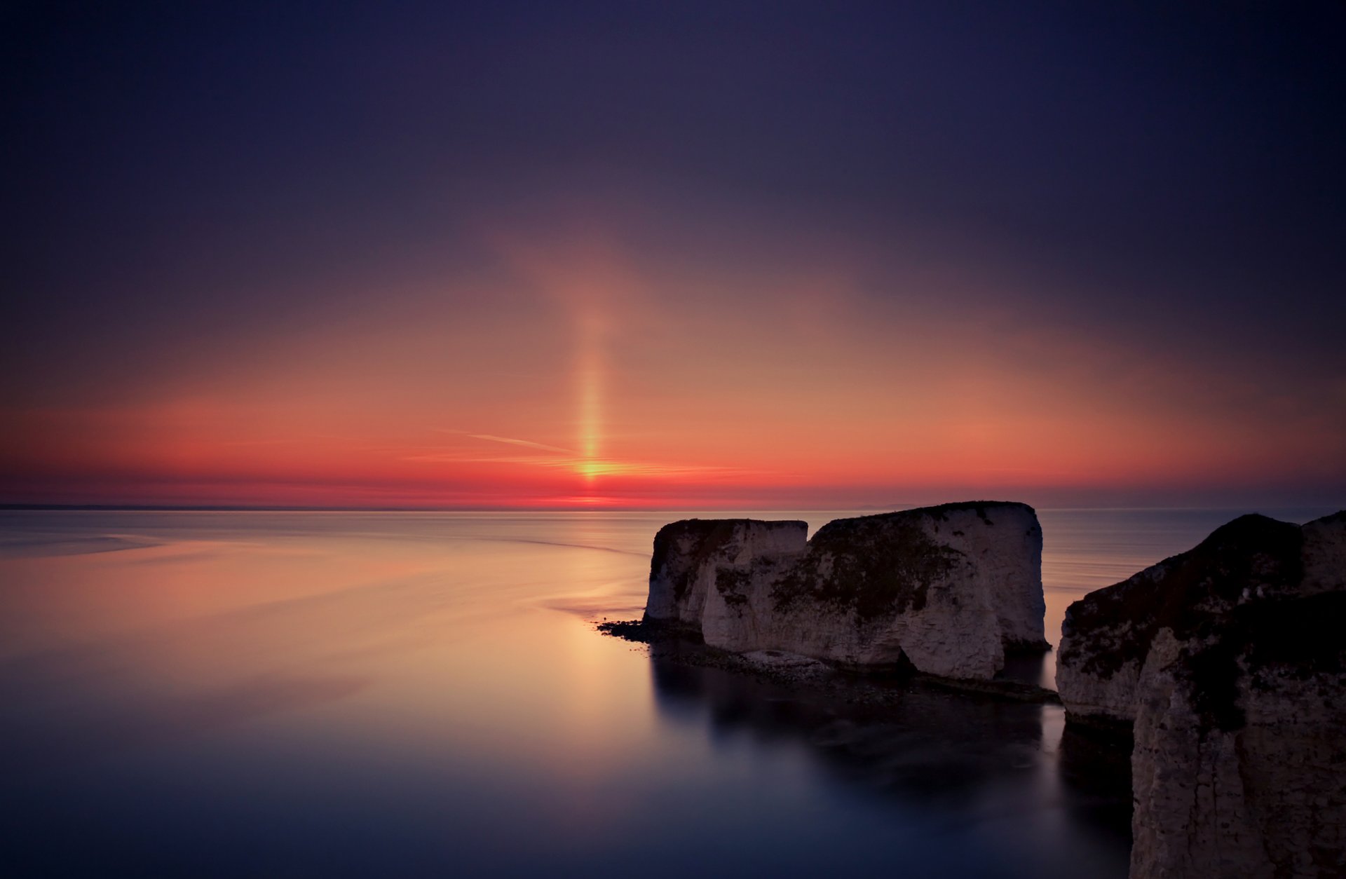 großbritannien england abend sonne sonnenuntergang berge küste meer wasser oberfläche ruhe