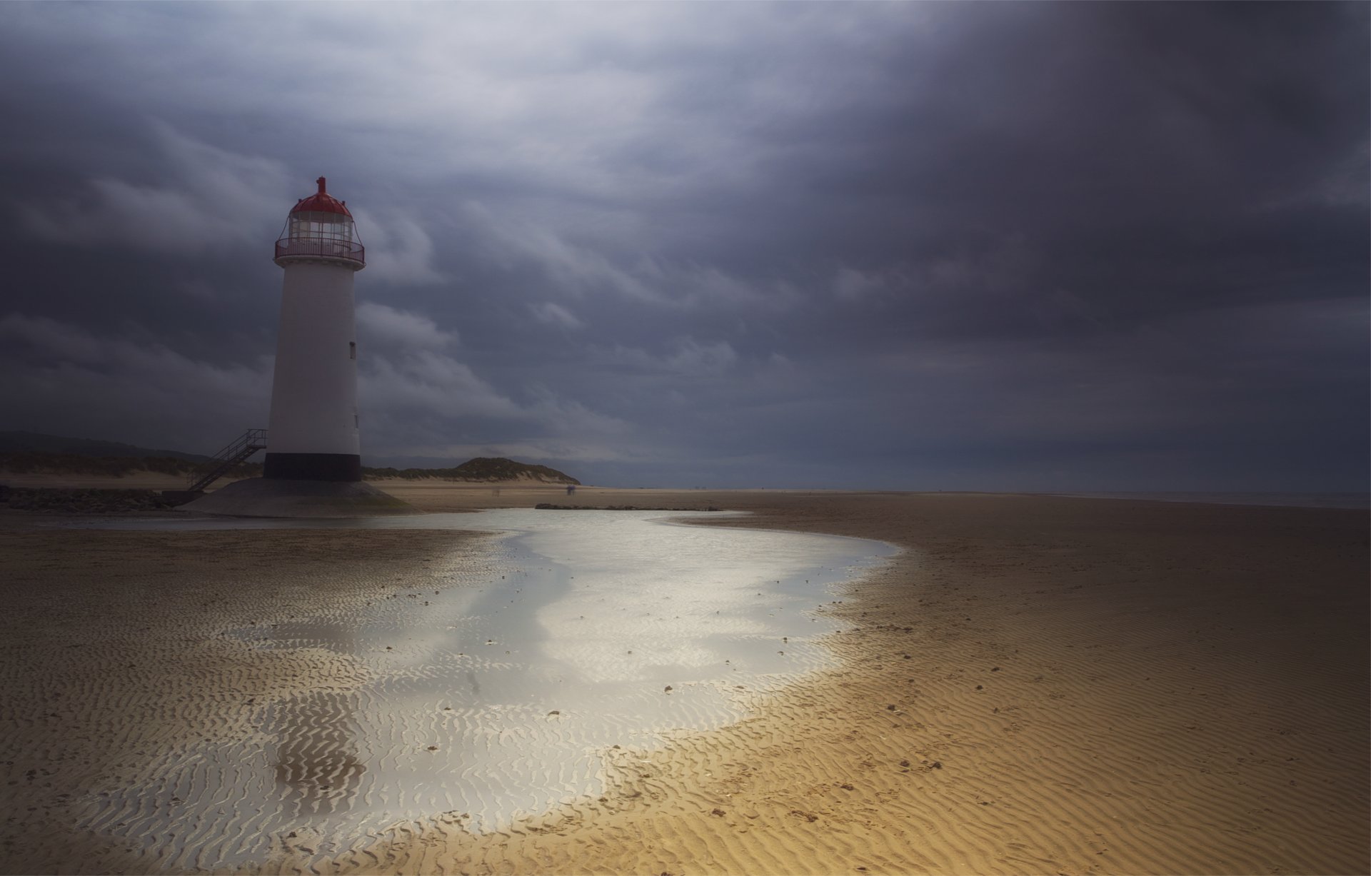 united kingdom england wales lighthouse sand water sky clouds the storm