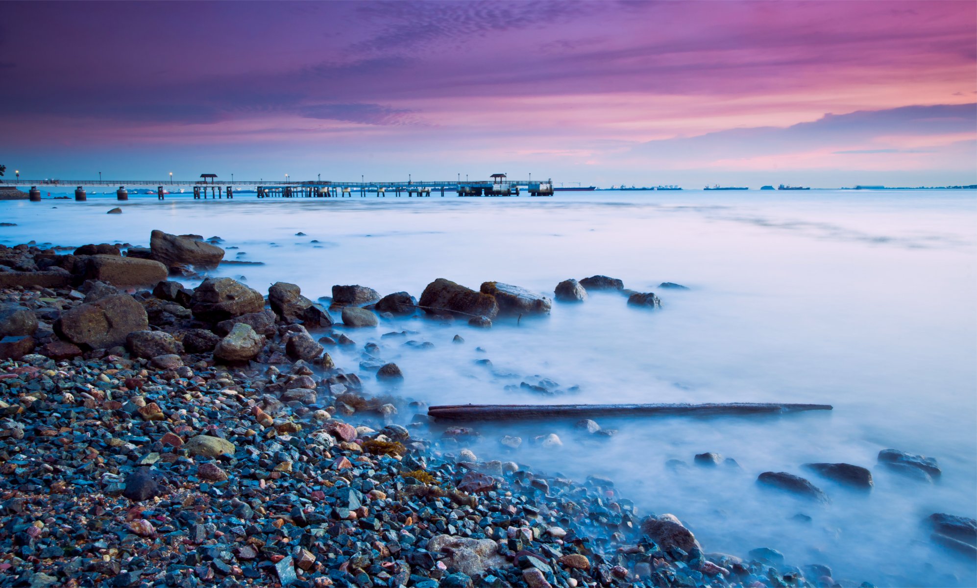 malaysia singapore twilight purple night sunset sky clouds sea coast beach stones bridge away