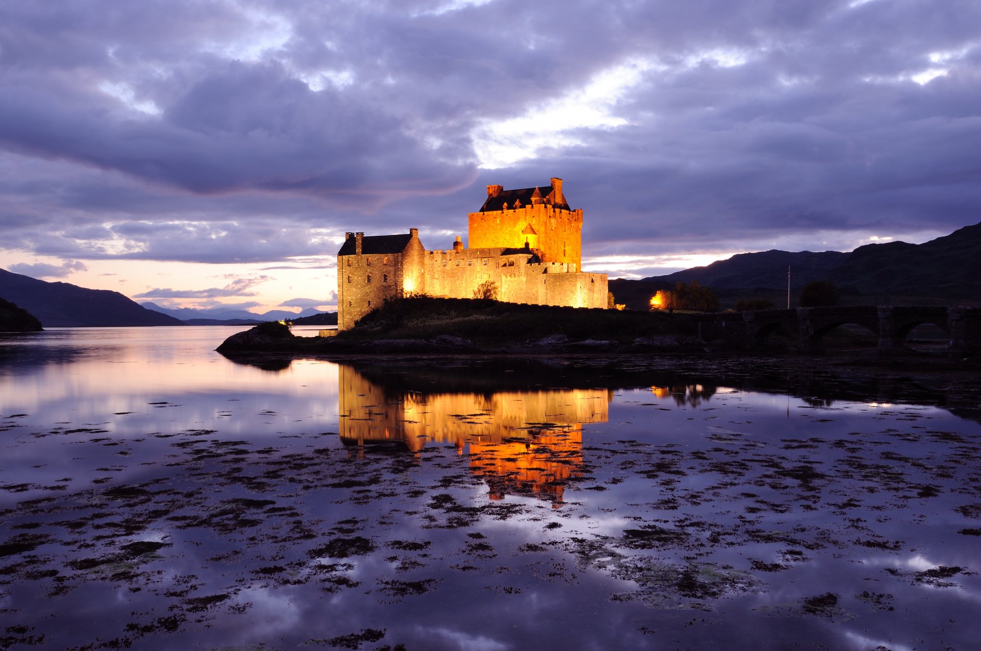 great britain scotland castle fortress illumination lilac evening sky clouds bridge pond water reflection