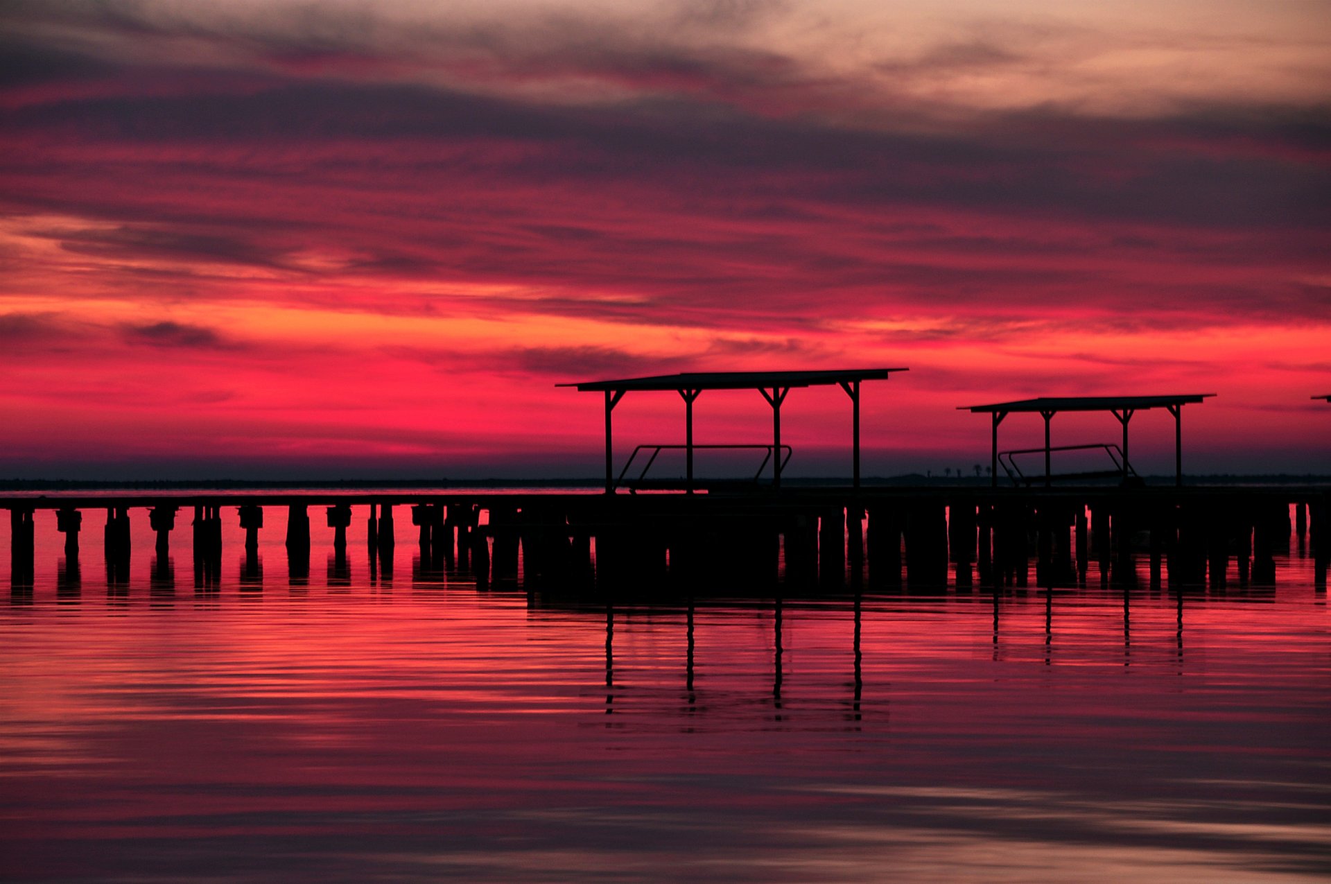 night twilight red sunset sky clouds lake pier