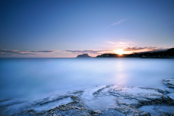 Sunset and the blue of the sea surface