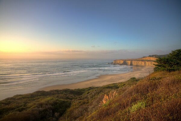 Sandstrand am Meer , Sonnenuntergang am Meer