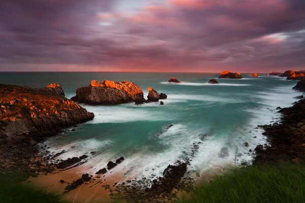 Rocks and sea in Cantabria. Beautiful sunsets in Spain