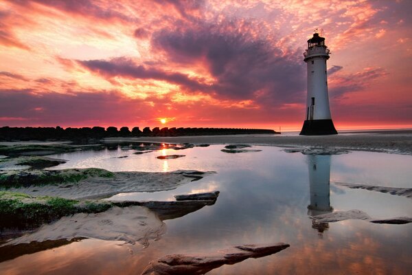 A lonely lighthouse in the sunset