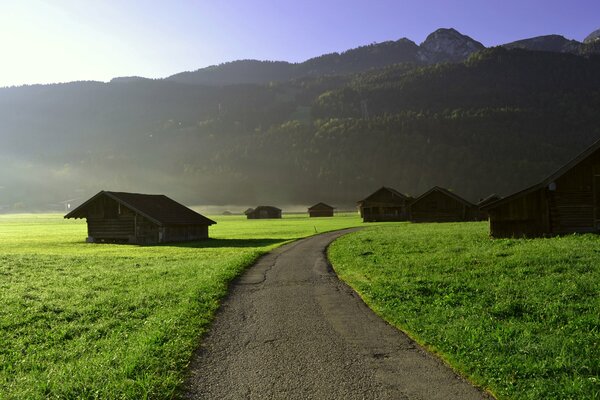 The road to the mountains through the plains and houses