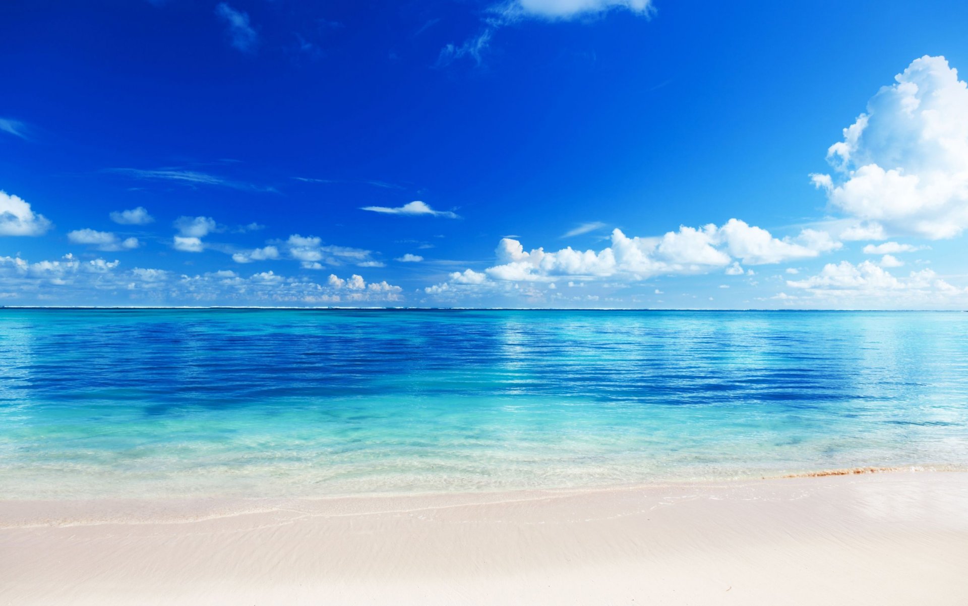 beach sand ocean horizon sky clouds blue