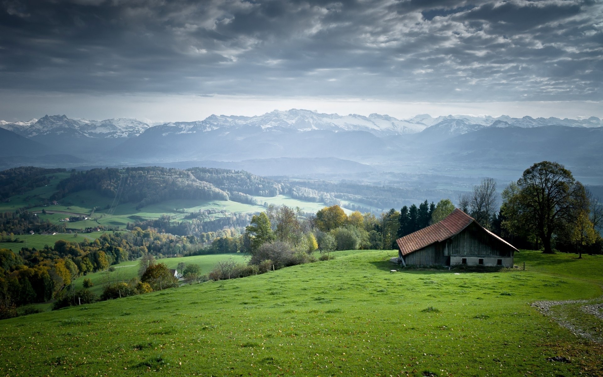 mountain valley hills grass field meadow meadows house landscape tree forest horizon sky clouds photo nature