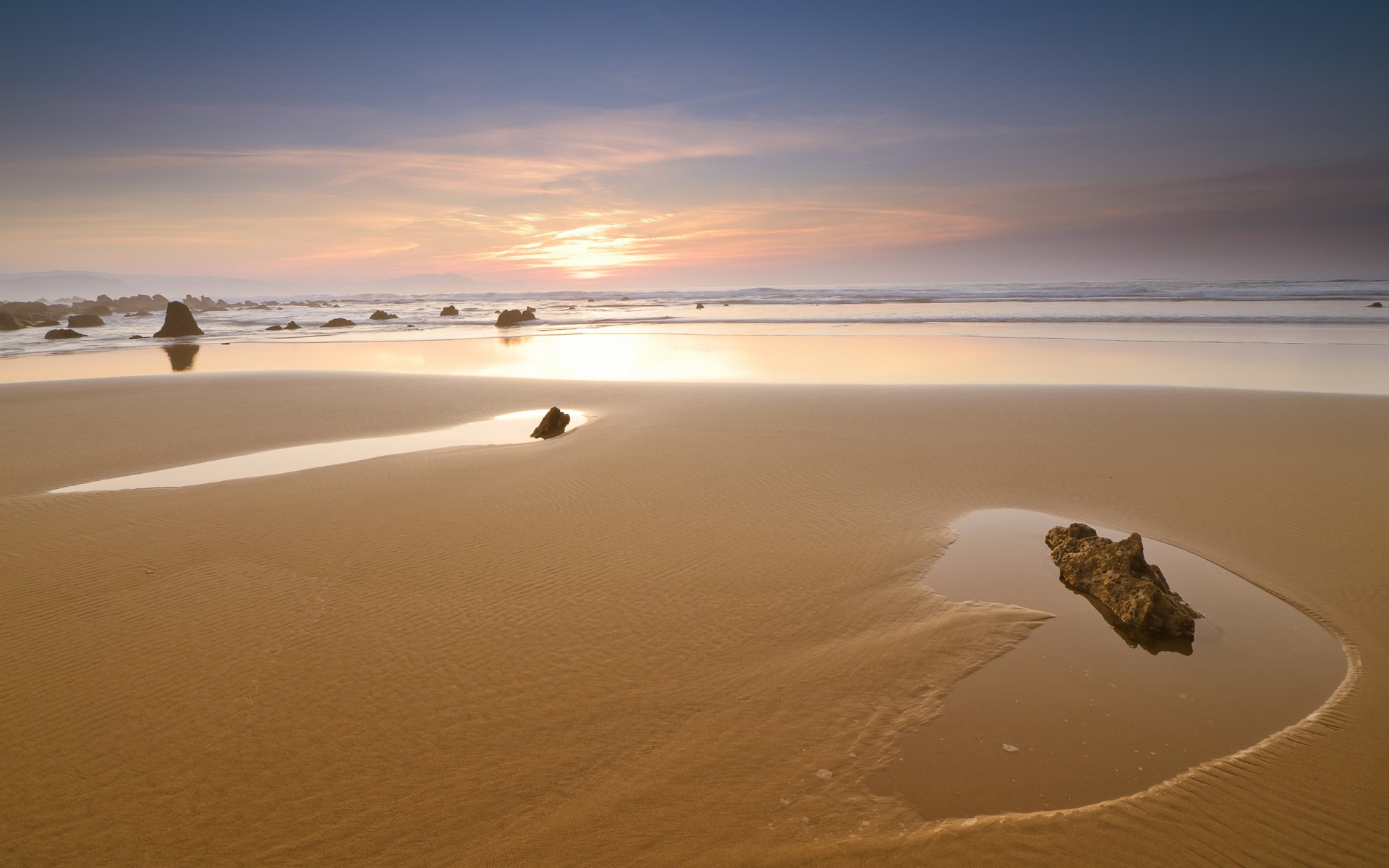 unset sky beach sand stones sea