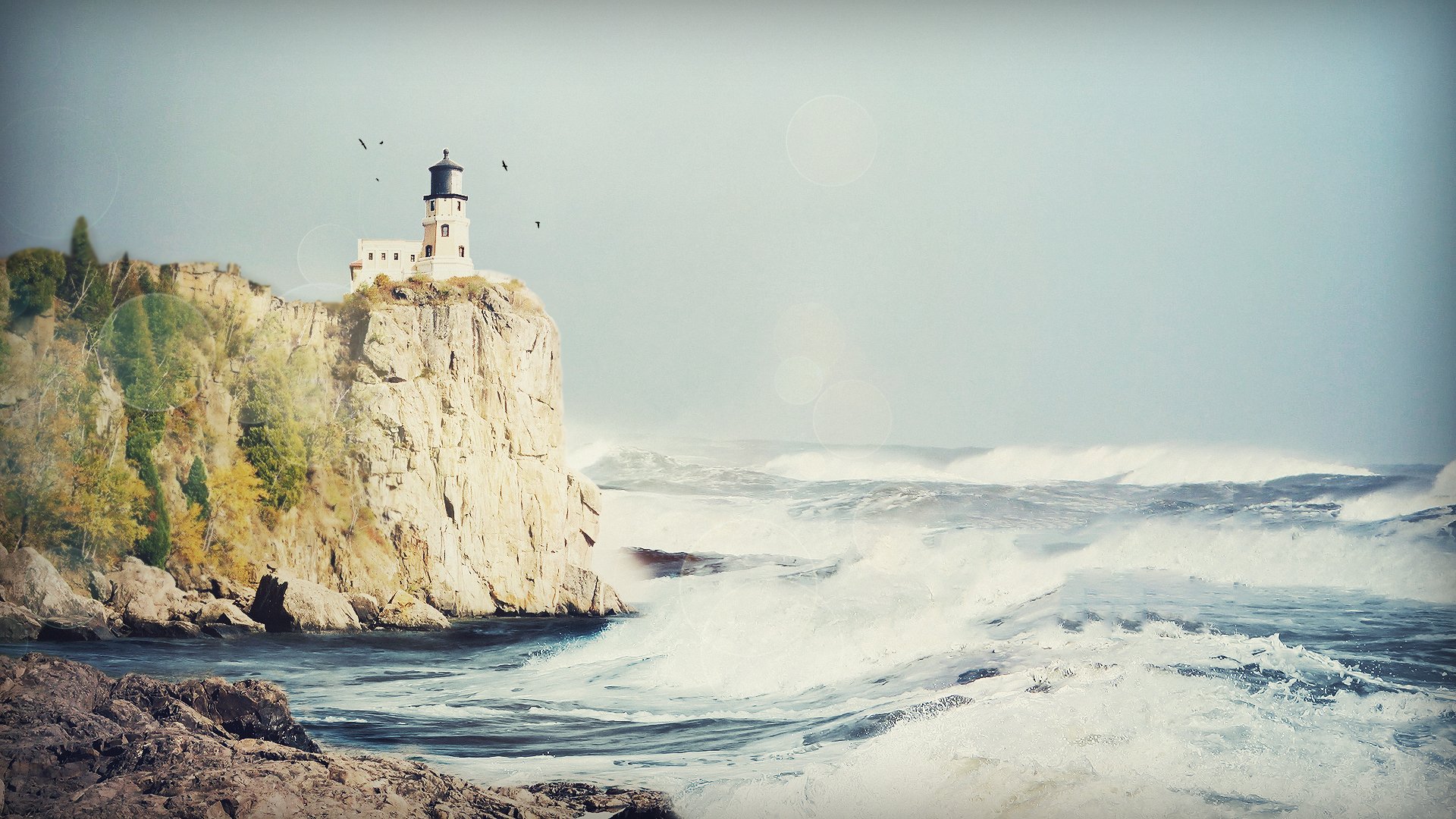 lighthouses shore water foam ocean sea spray waves stone stones sky rock rocks birds glare light