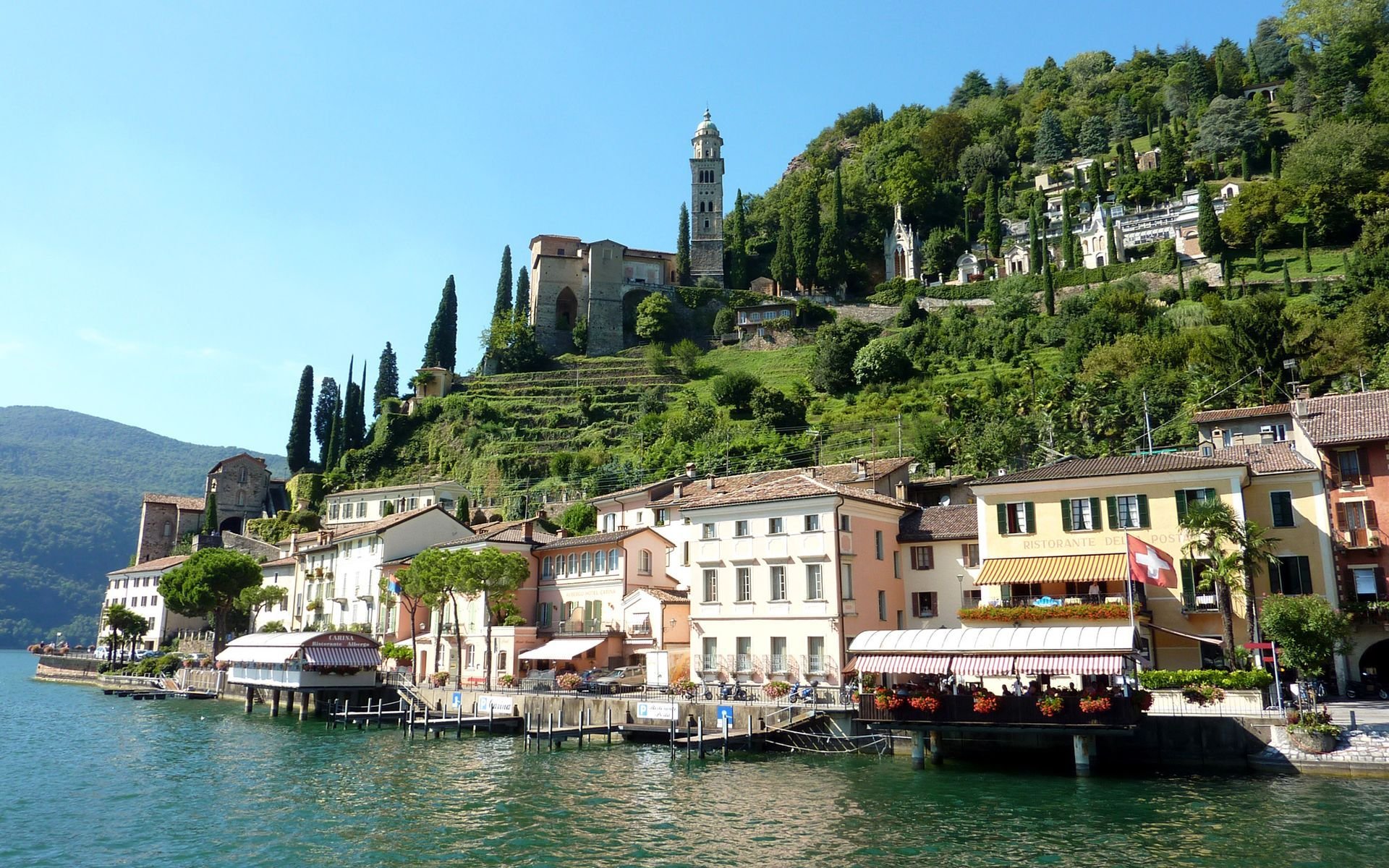 svizzera alberi molo lago edifici case