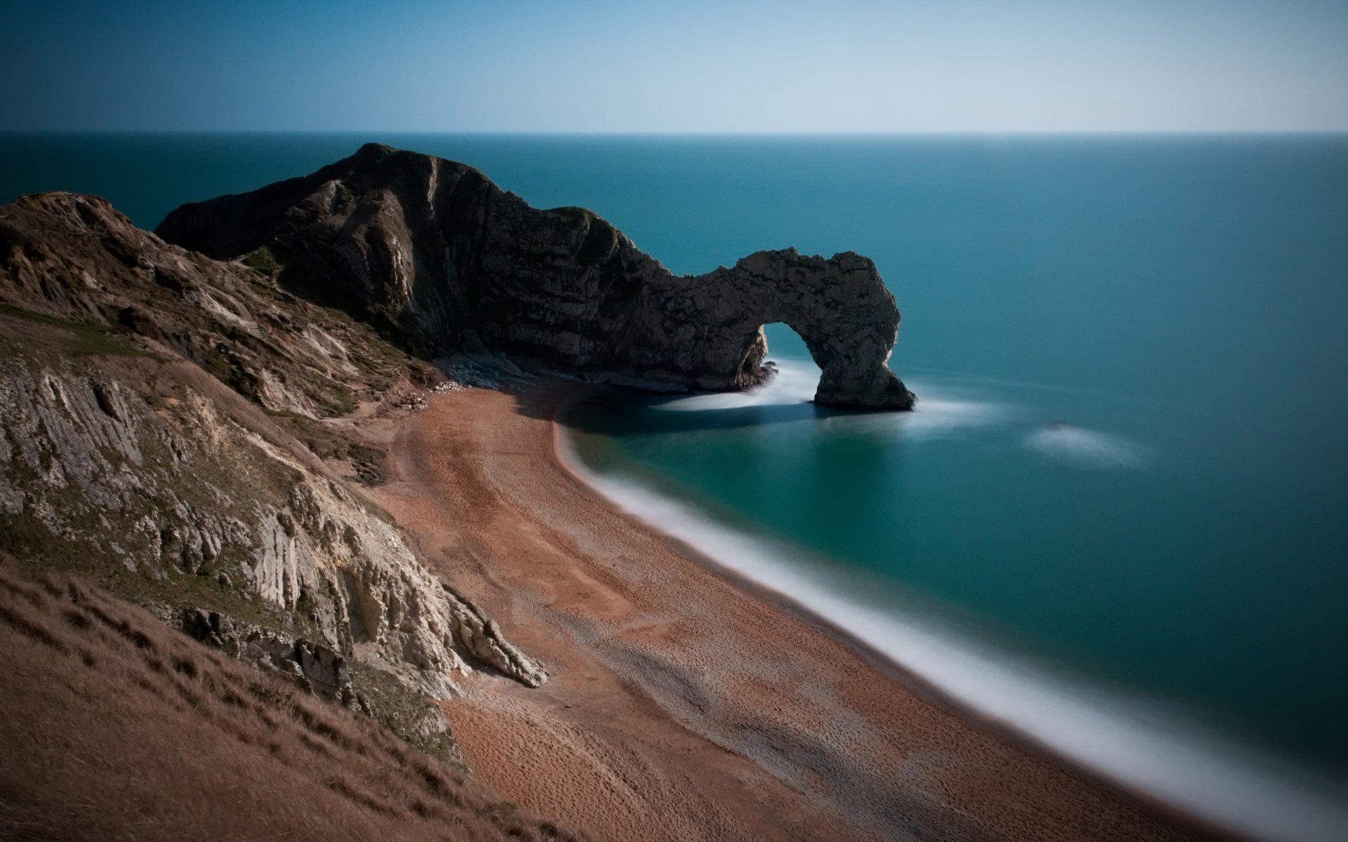 bellissimi luoghi arco archi spiagge costa costa sabbia roccia rocce cancello acqua oceano mare inghilterra gran bretagna gran bretagna pendii colline erba pietra pietre foto di paesaggi