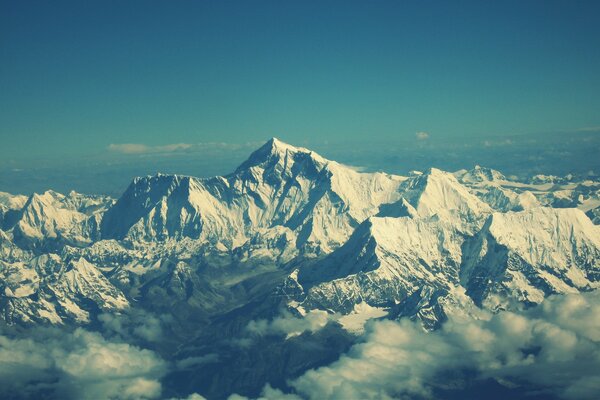 Landscape of mountains. Everest in the clouds