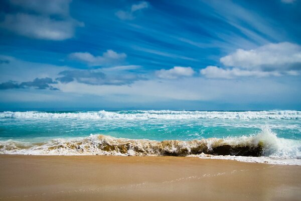 The splashing of ocean waves on the sand