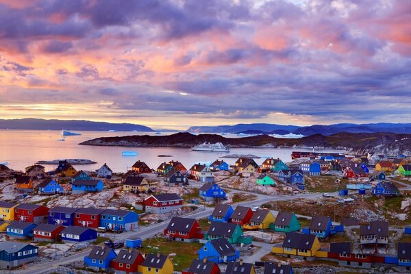 Many different colored houses by the sea