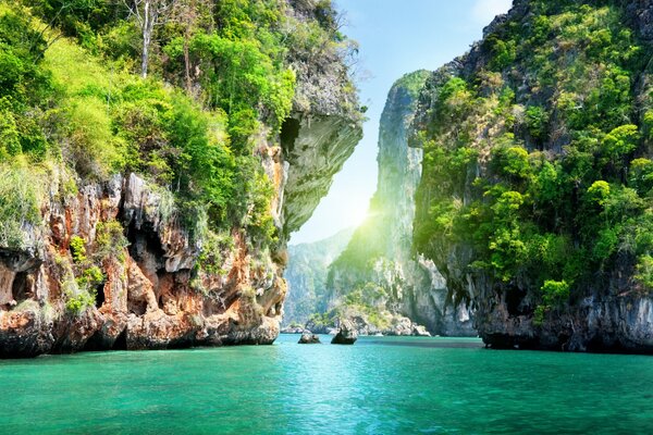 The sun on the background of water and rocks