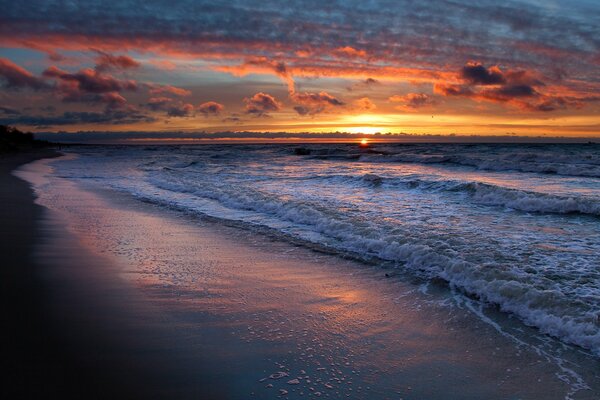 Sand on the beach against the background of sunset