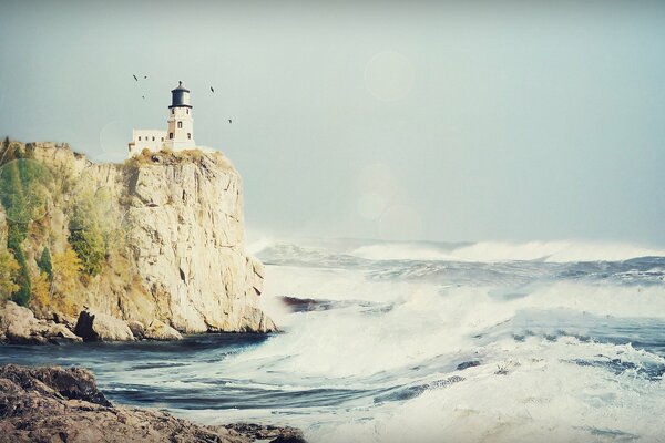 Splashes of waves from the sea to the shore and rocks