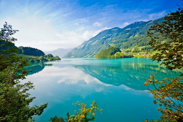 Azure lake with houses on the shore