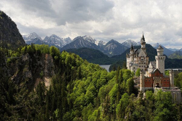 Germany. Neuschwanstein Castle towers on the background of mountains