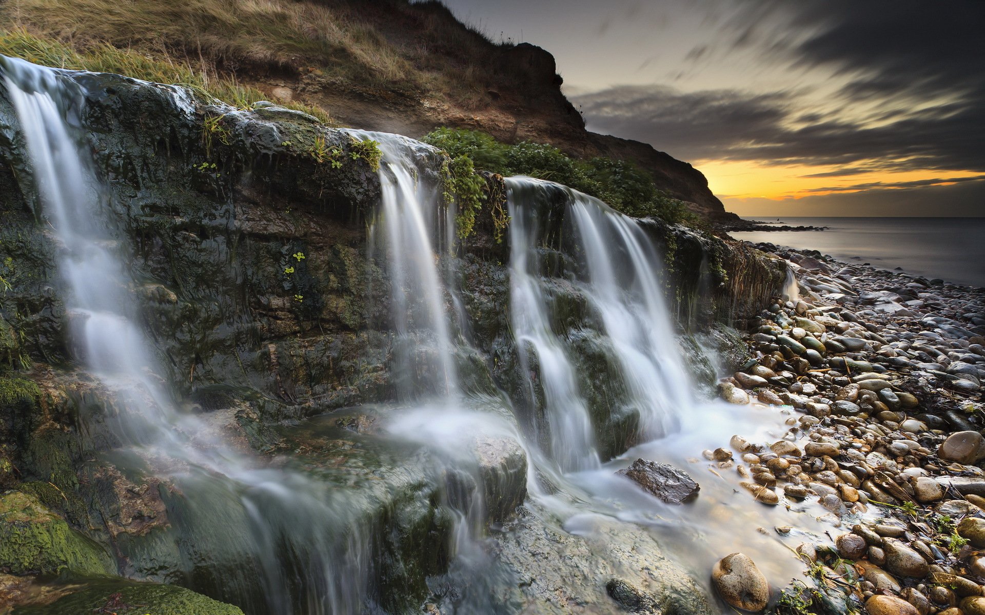 osmington mills costa jurásica cascada dorset puesta de sol