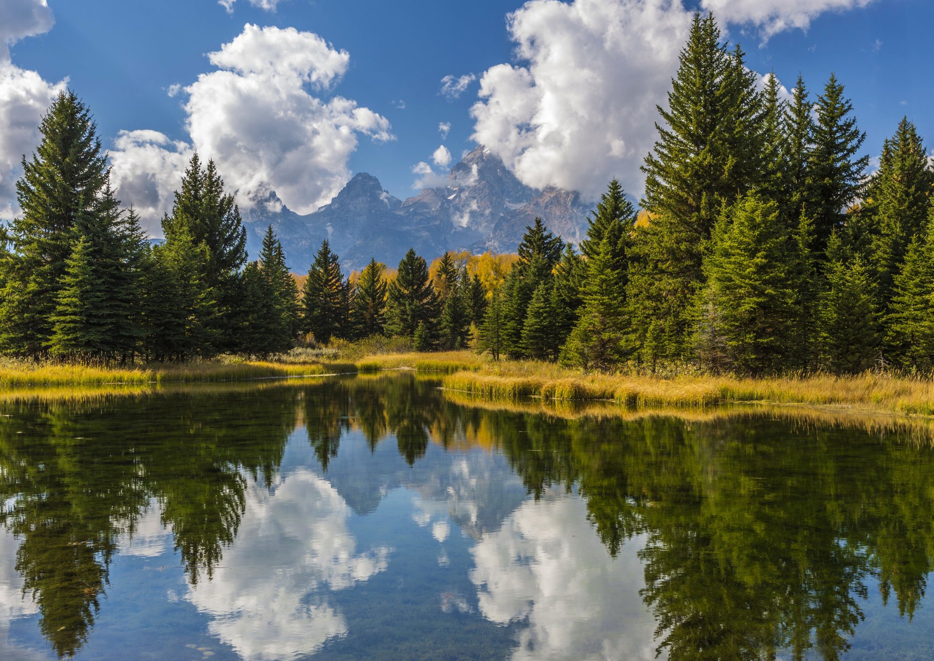 montagnes forêt arbres eau réflexion ciel soleil nuages états-unis grand teton national park grand teton