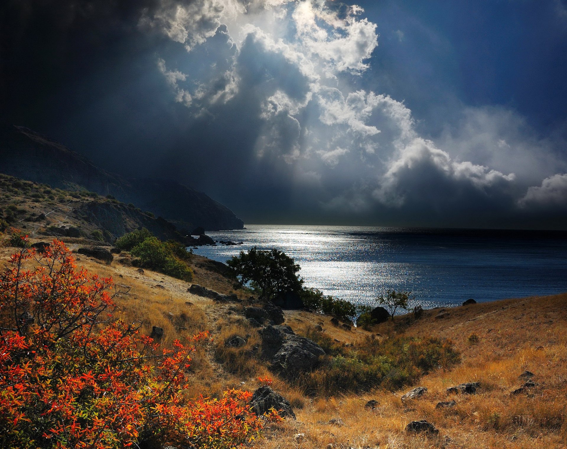 crimea black sea coast mountain stones bush grass sky clouds sun rain