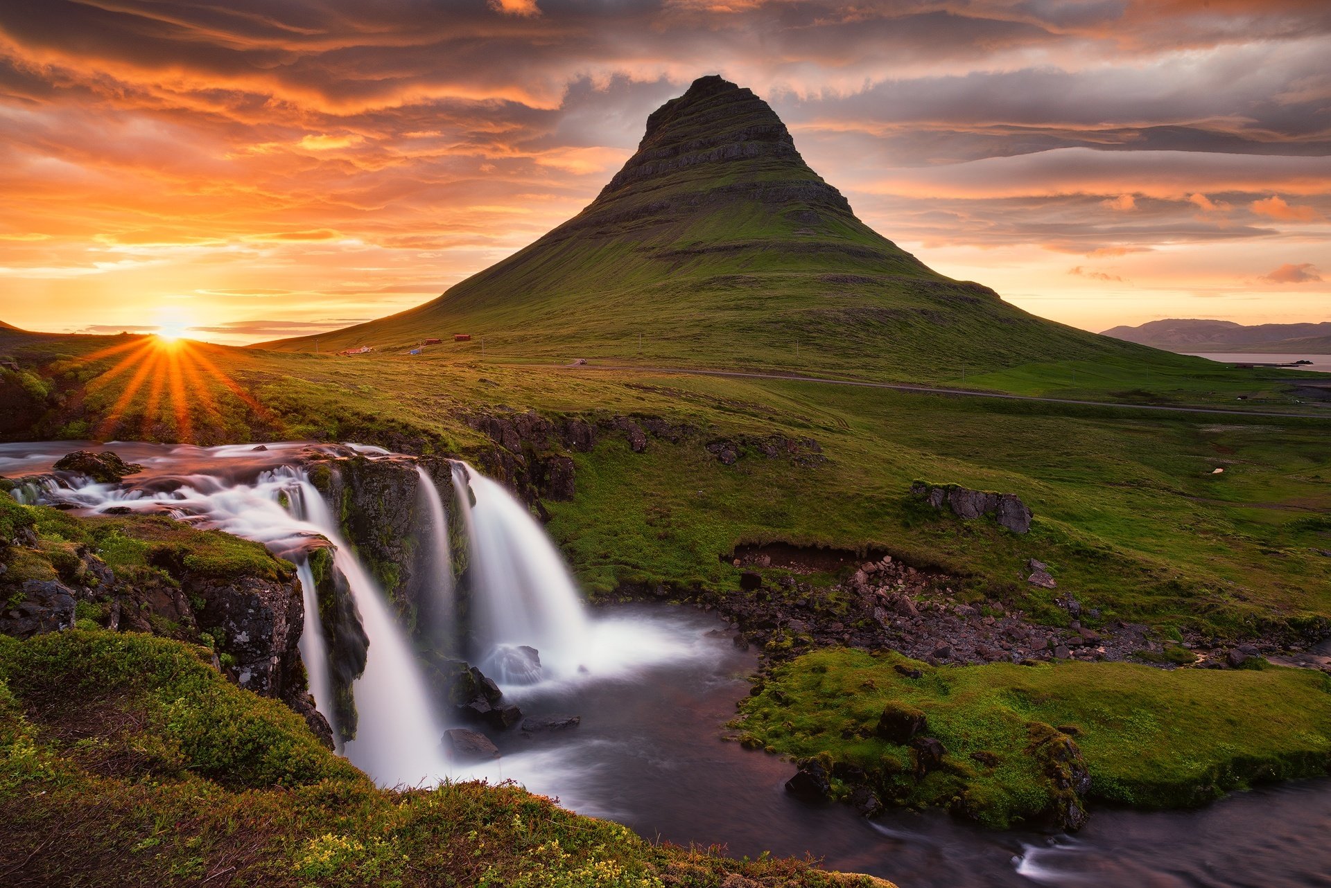 iceland kirkjufell mountain volcano rock waterfall sky clouds sun