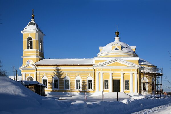 Church in winter landscape, red Church in the sun, sun and winter landscape, Church at sunset in winter