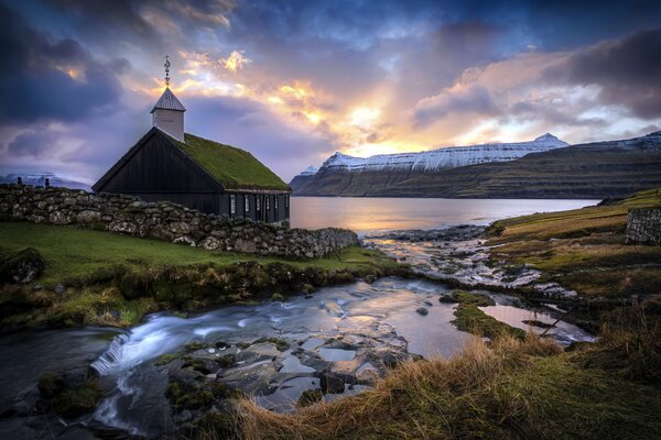 Landscape church on the Faroe Islands at sunset