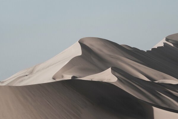 Grey desert with blue sky