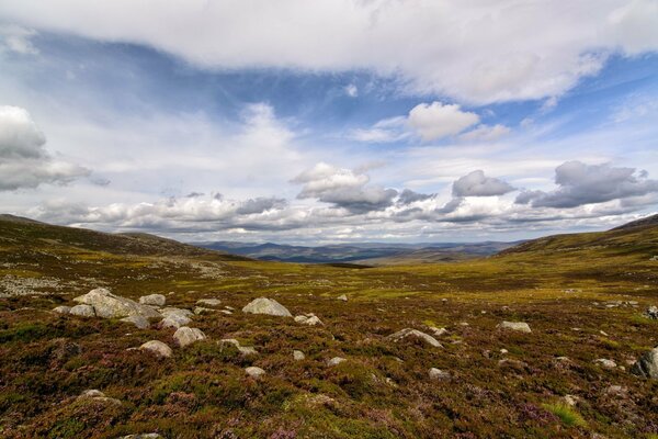 Rocky steppe and low clouds. Untouched nature, expanse