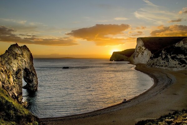 Sea coast with a beach between rocks