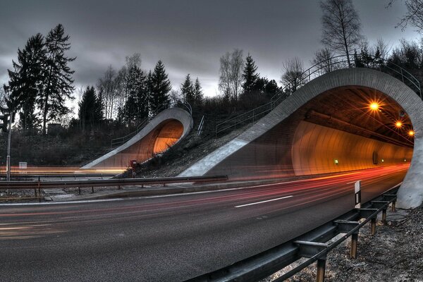 Light in the tunnel against the gray sky