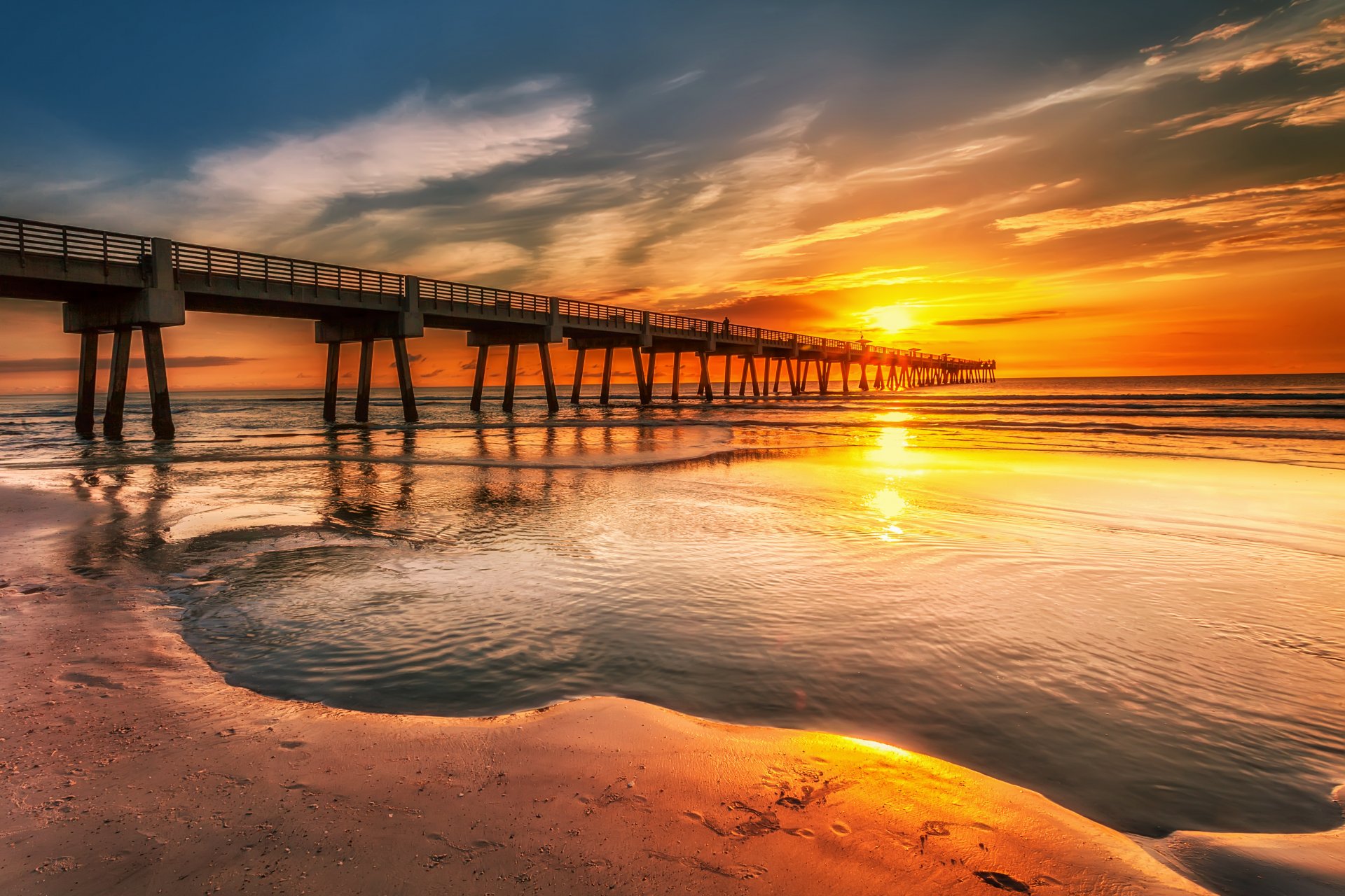 ky clouds sunset pier pier sea shore sand footprints people